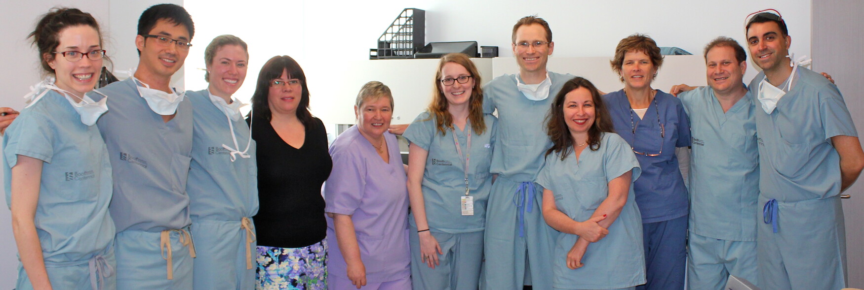 Group of men and women in scrubs